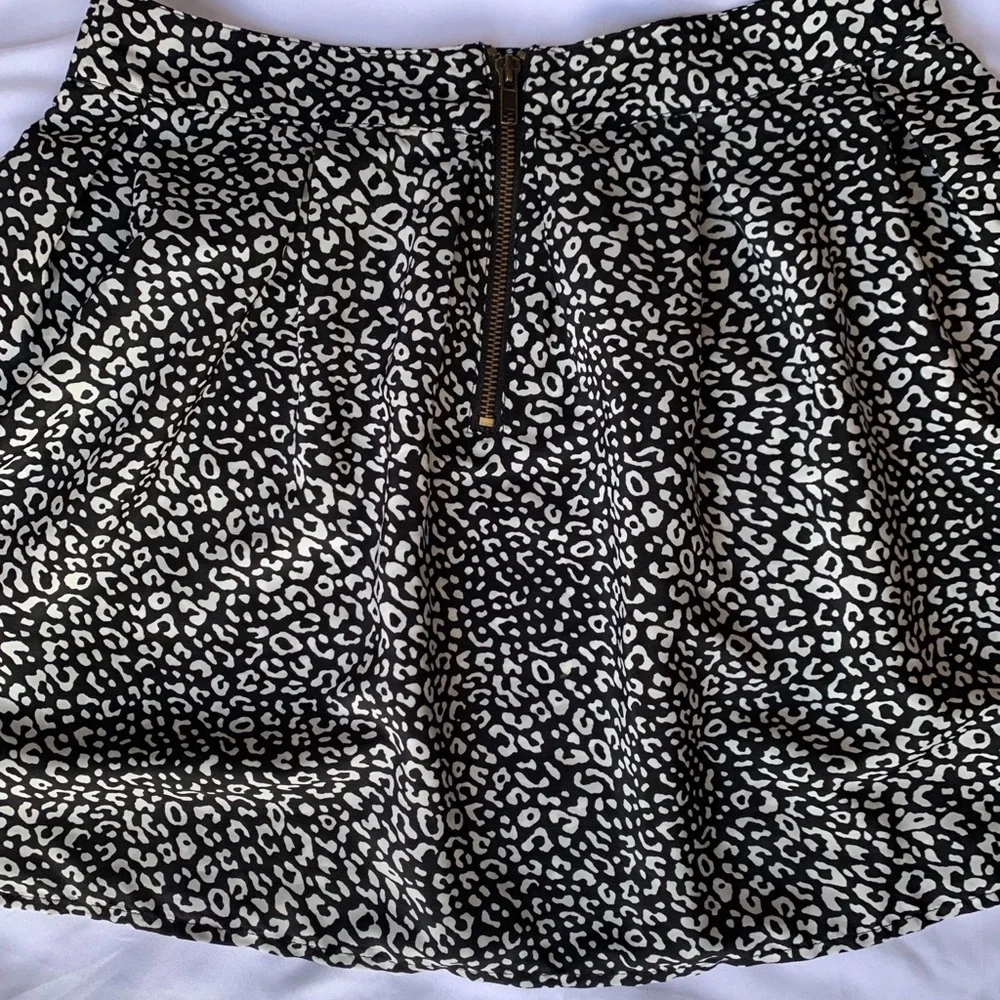 Above the knee black and white skirt